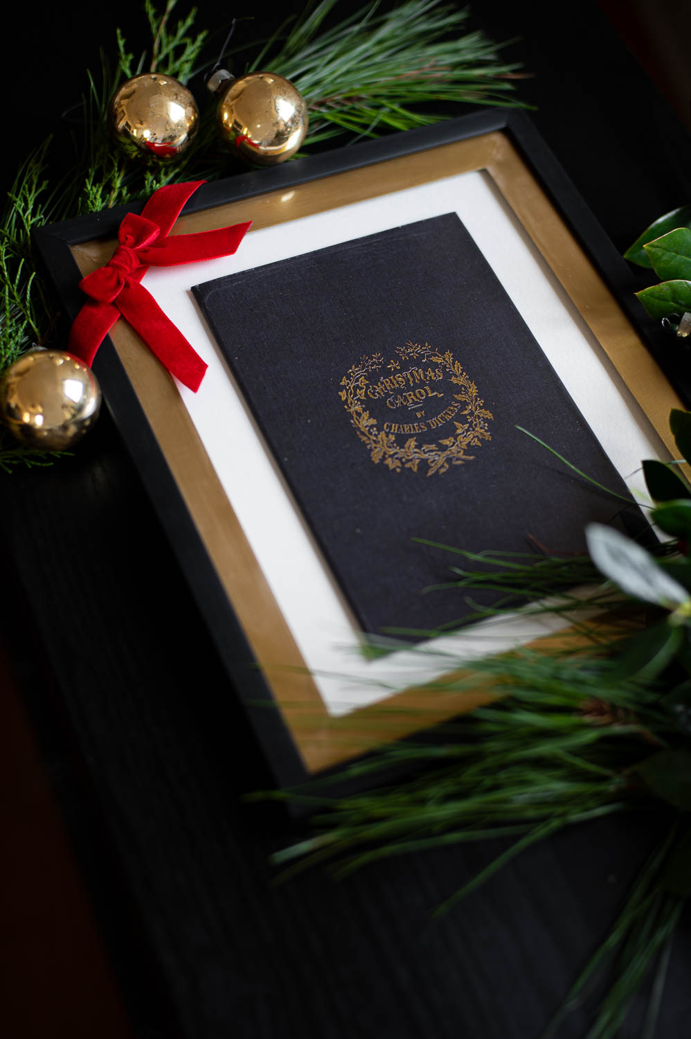 diy christmas carol framed wall art made with dollar tree supplies and the cover of charles dickens a christmas carol