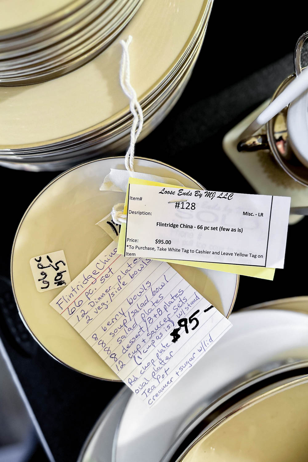 a 66 piece set of flintridge china for sale at an estate sale.
