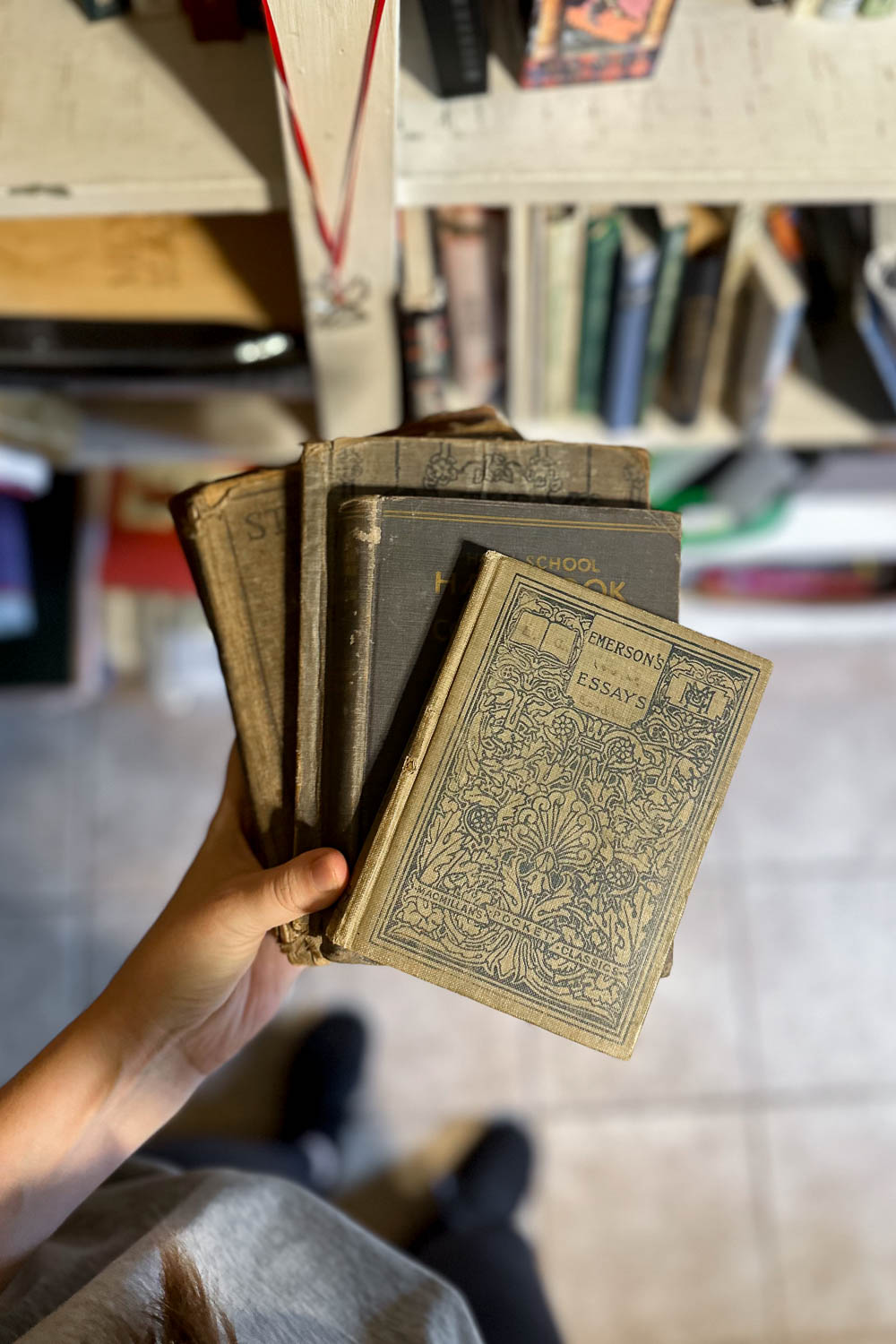 vintage books for sale at an estate sale.