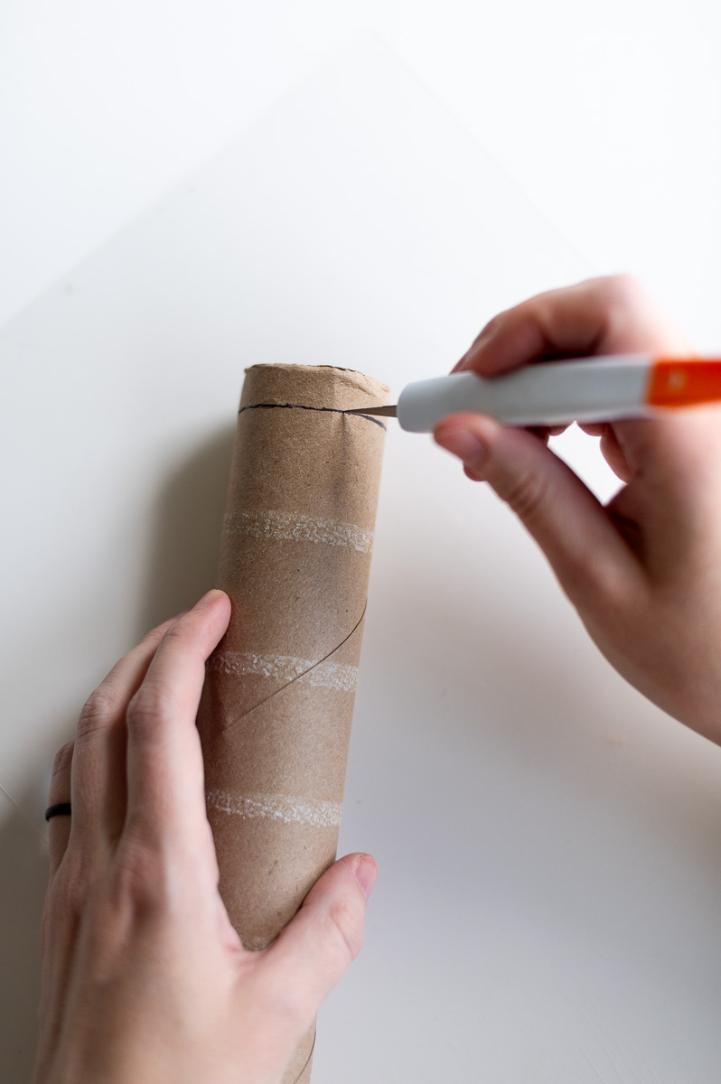 Step-by-step tutorial showing how to make red velvet DIY napkin rings using paper towel cardboard tubes and toilet paper cardboard tubes for Christmas entertaining.