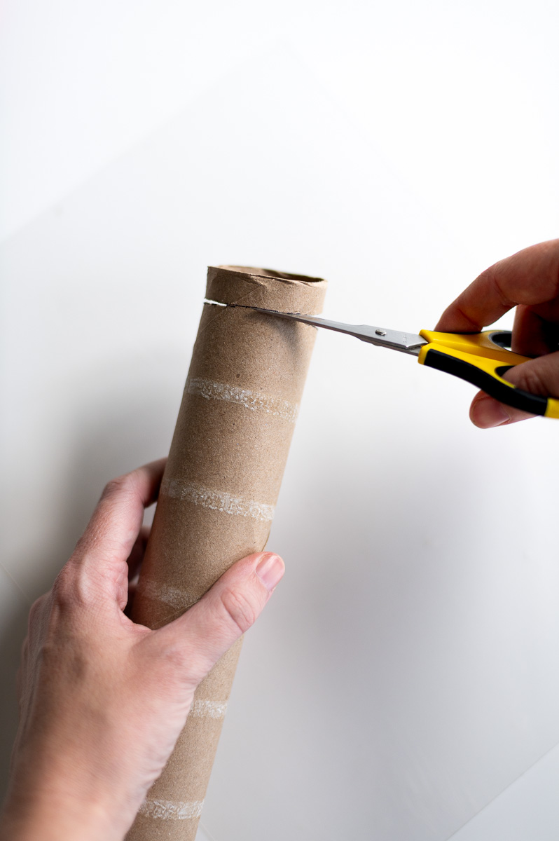 Step-by-step tutorial showing how to make red velvet DIY napkin rings using paper towel cardboard tubes and toilet paper cardboard tubes for Christmas entertaining.