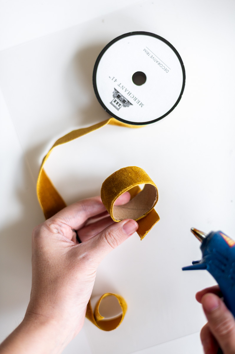 Step-by-step tutorial showing how to make gold velvet DIY Thanksgiving Napkin Rings for Thanksgiving entertaining.