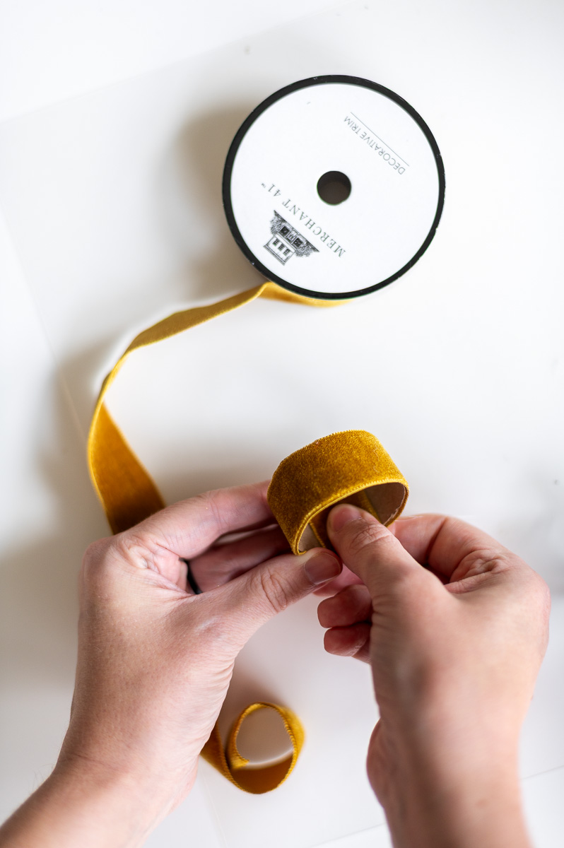 Step-by-step tutorial showing how to make gold velvet DIY Thanksgiving Napkin Rings for Thanksgiving entertaining.