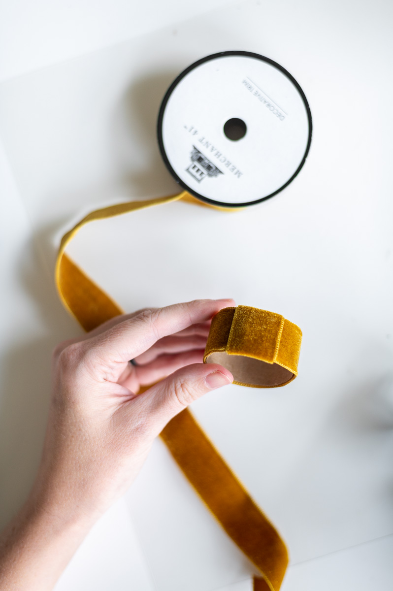 Step-by-step tutorial showing how to make gold velvet DIY Thanksgiving Napkin Rings for Thanksgiving entertaining.