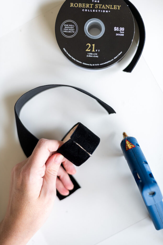 Step-by-step tutorial showing how to make black velvet DIY Napkin Rings for holiday entertaining.