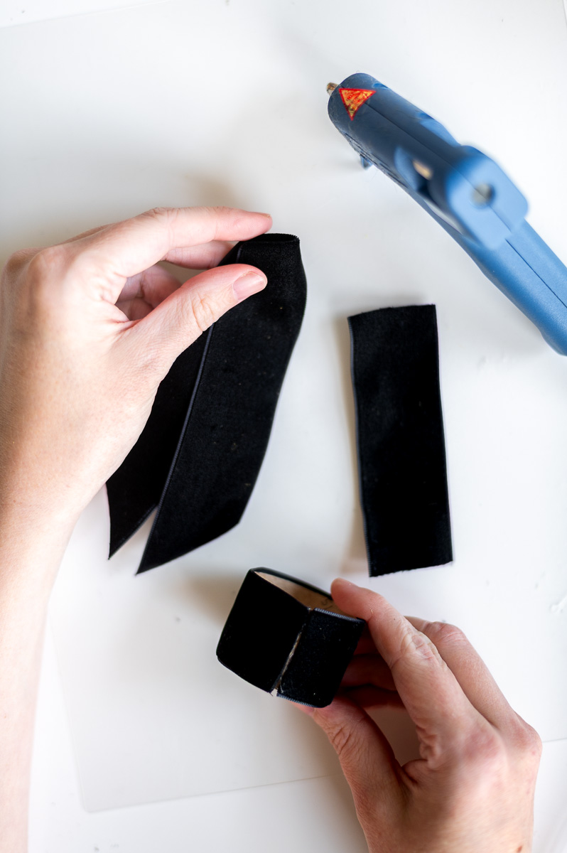 Step-by-step tutorial showing how to make black velvet DIY Napkin Rings for holiday entertaining.
