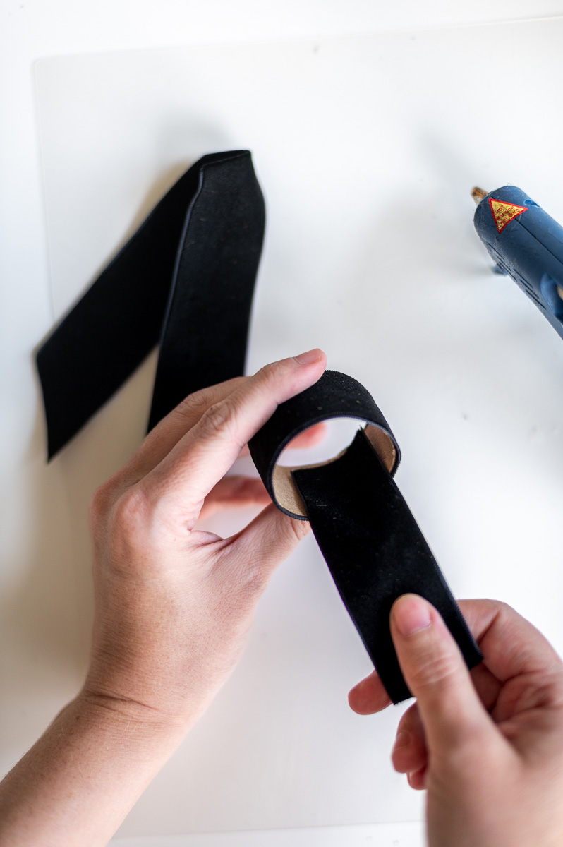 Step-by-step tutorial showing how to make black velvet DIY Napkin Rings for holiday entertaining.