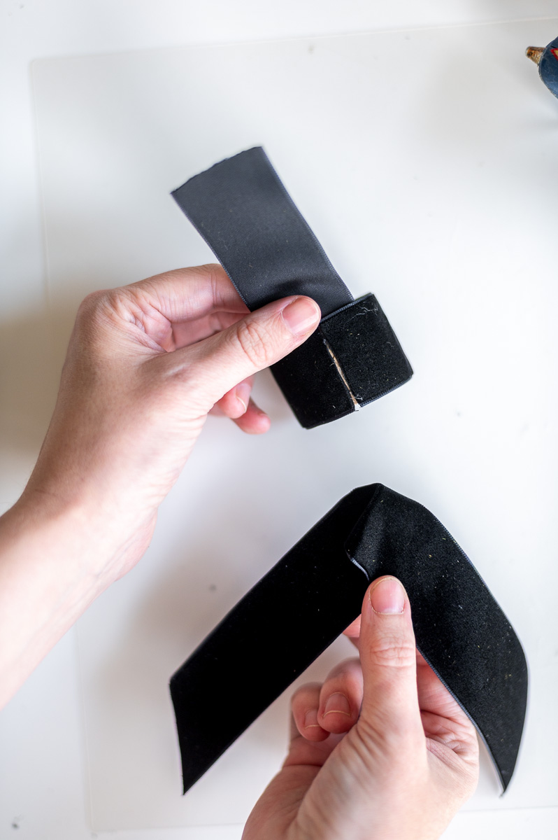 Step-by-step tutorial showing how to make black velvet DIY Napkin Rings for holiday entertaining.