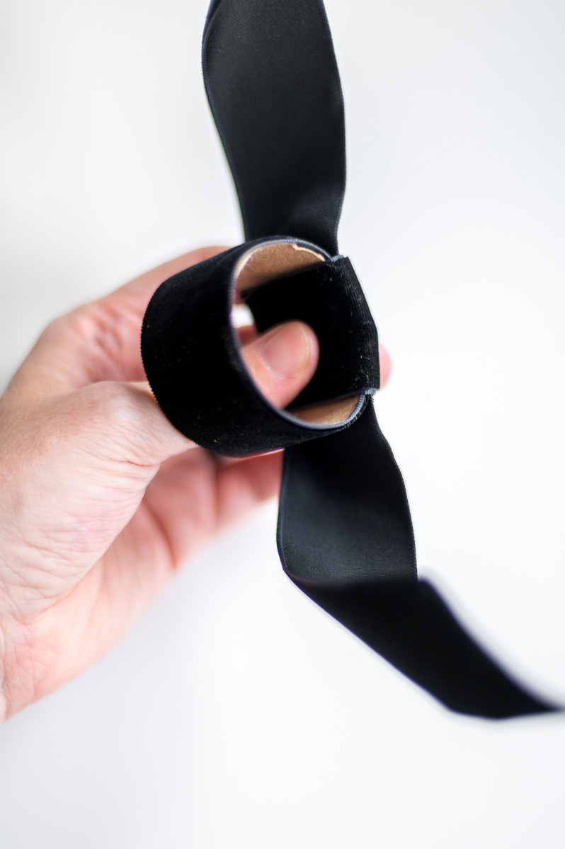 Step-by-step tutorial showing how to make black velvet DIY Napkin Rings for holiday entertaining.