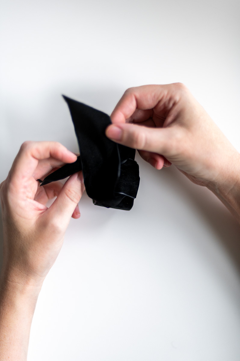 Step-by-step tutorial showing how to make black velvet DIY Napkin Rings for holiday entertaining.