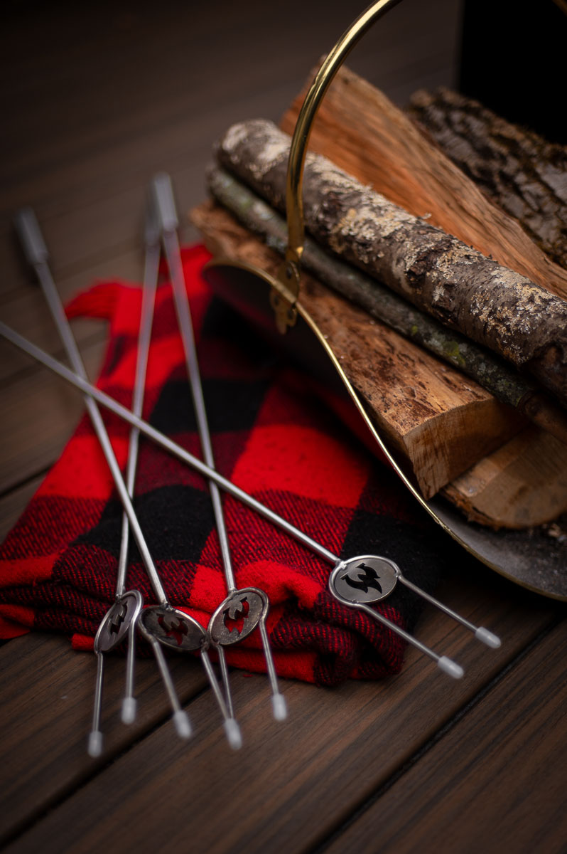 Heavy-duty stainless steel roasting forks shown with Solo Stove for a fall campfire party.