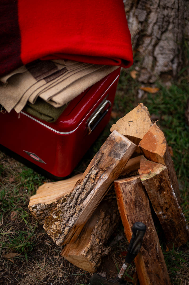 Stacked firewood as rustic decor for a fall bonfire night party.