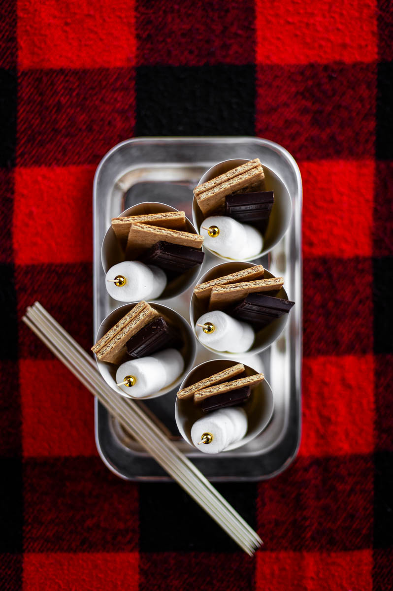 DIY s'mores kits charcuterie cups at a backyard bonfire party.
