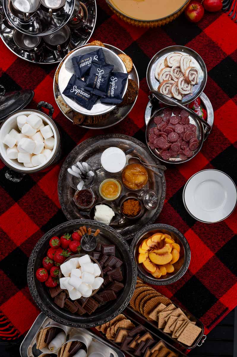 S’mores charcuterie board on vintage silver platters for bonfire night party dessert table