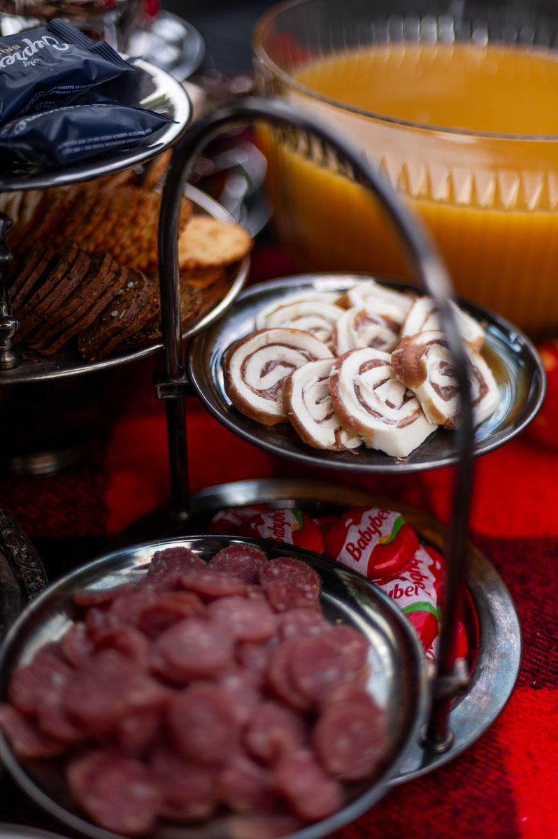 Creative savory s’mores charcuterie board filled with meats, cheeses, and spreads for a backyard s’mores party.