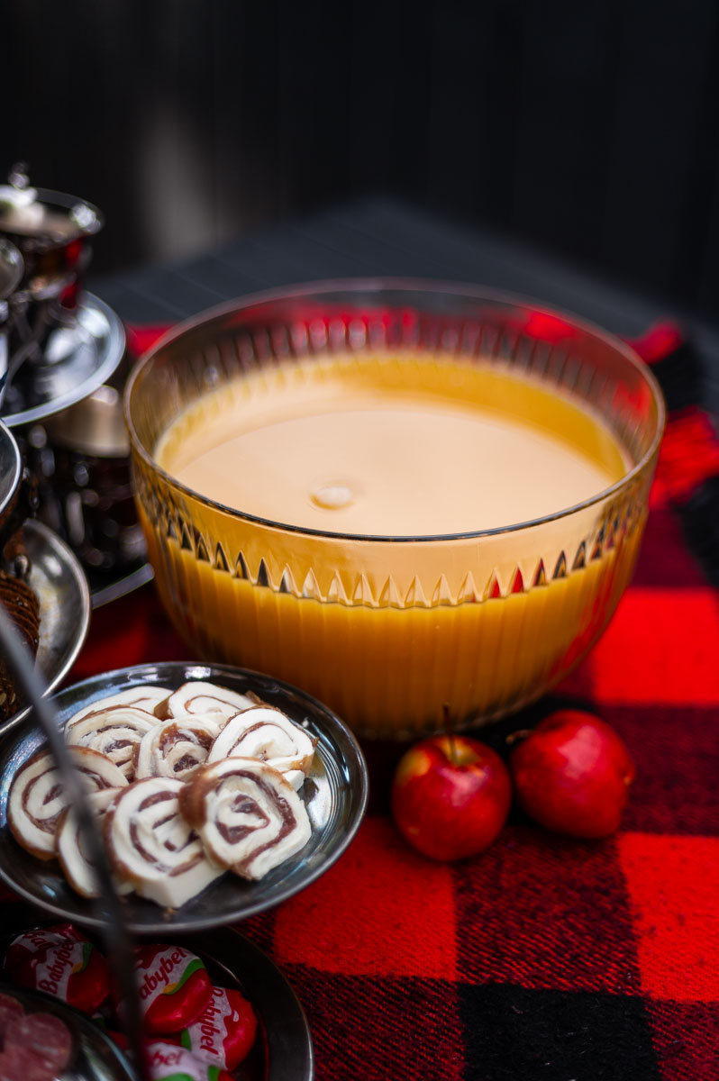 Elegant fall party punch served in a vintage glass bowl with vintage silver cups, great for autumn punch recipes non alcoholic and Thanksgiving punch non alcoholic ideas.
