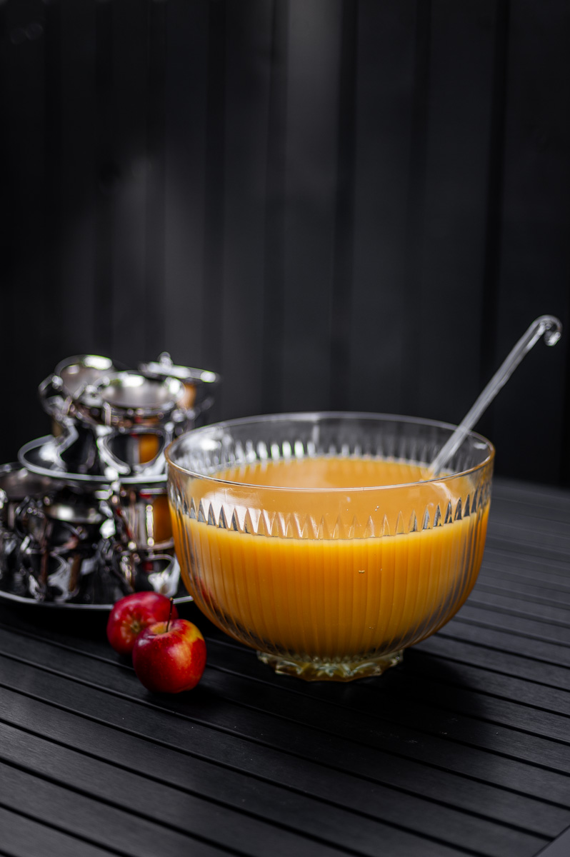 Elegant fall party punch served in a vintage glass bowl with vintage silver cups, great for autumn punch recipes non alcoholic and Thanksgiving punch non alcoholic ideas.