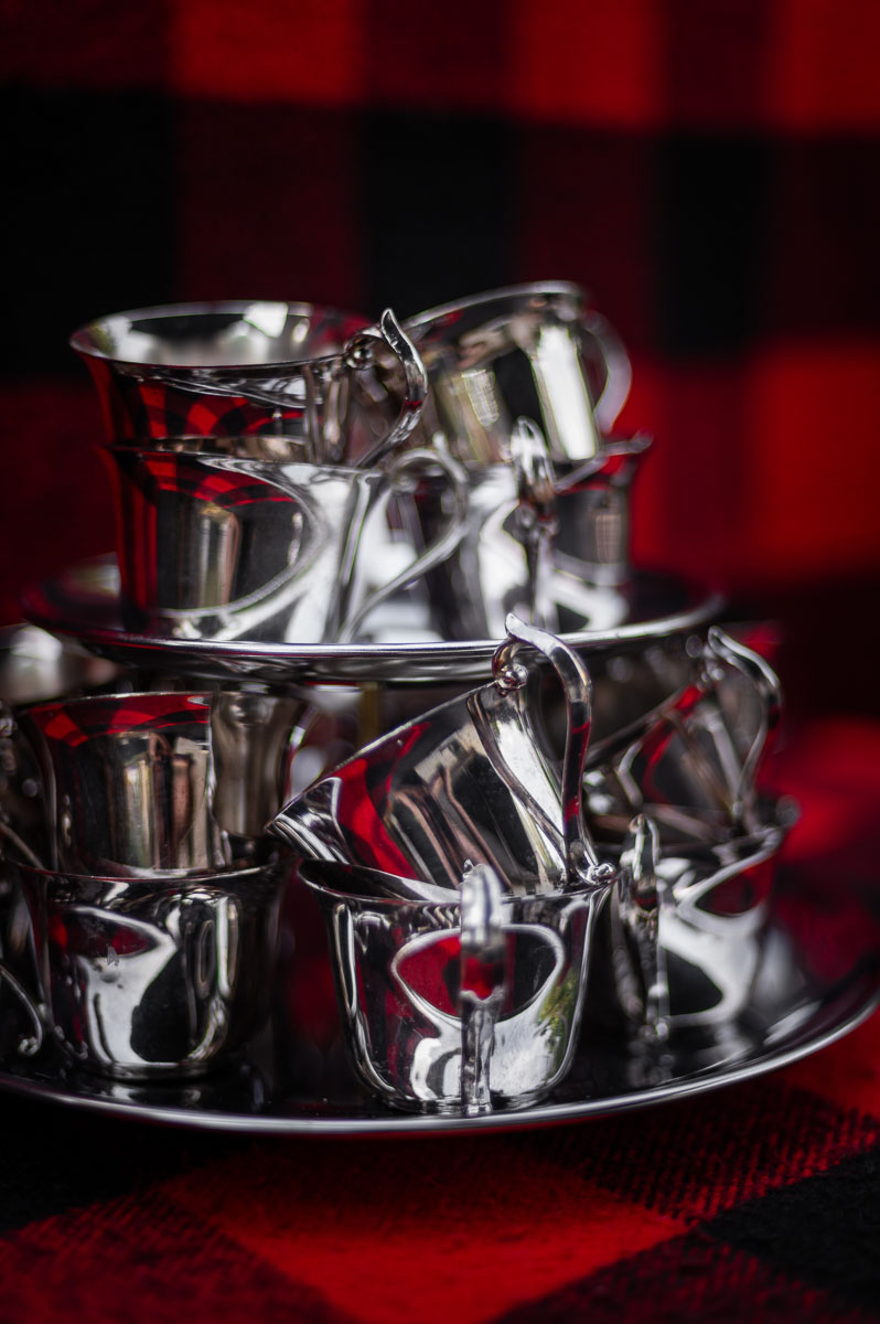 Close-up of vintage silver punch cups ready for serving apple cider punch non alcoholic, perfect for harvest punch, fall party punch, and autumn punch recipes non alcoholic.