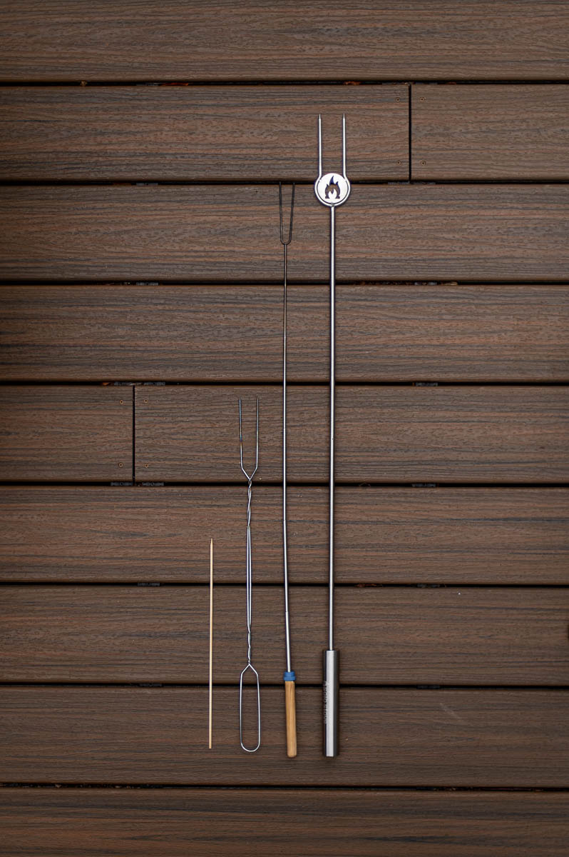 Collection of four different campfire roasting sticks compared wtih each other for a backyard bonfire party.