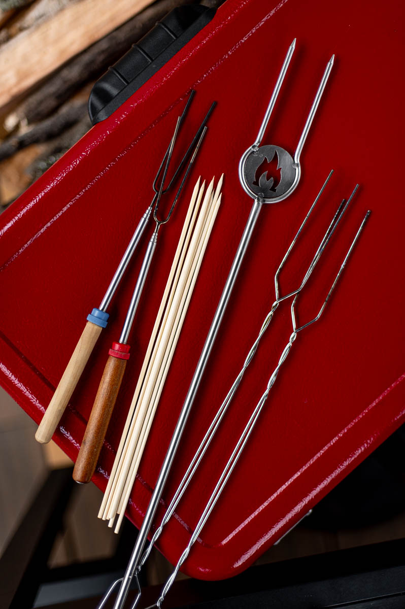 Assorted marshmallow roasting sticks and skewers displayed for a fall campfire party.