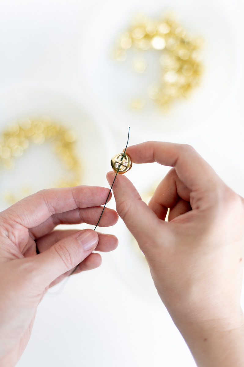 DIY holiday garland tutorial using gold jingle bells for elegant Christmas decor
