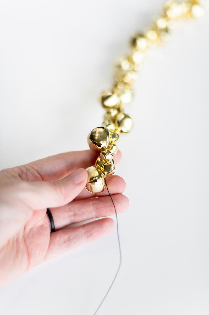 DIY holiday garland tutorial using gold jingle bells for DIY Christmas decor