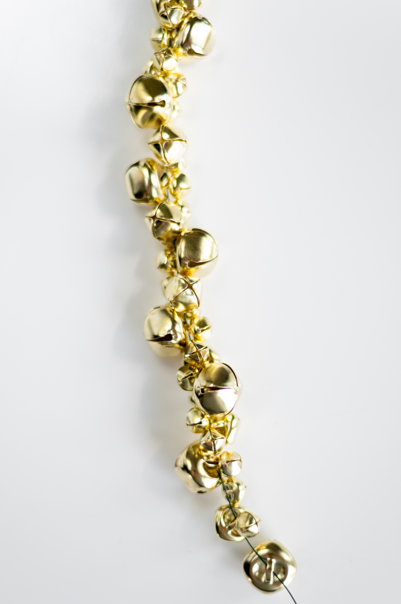 DIY holiday garland tutorial using gold jingle bells for DIY Christmas decor