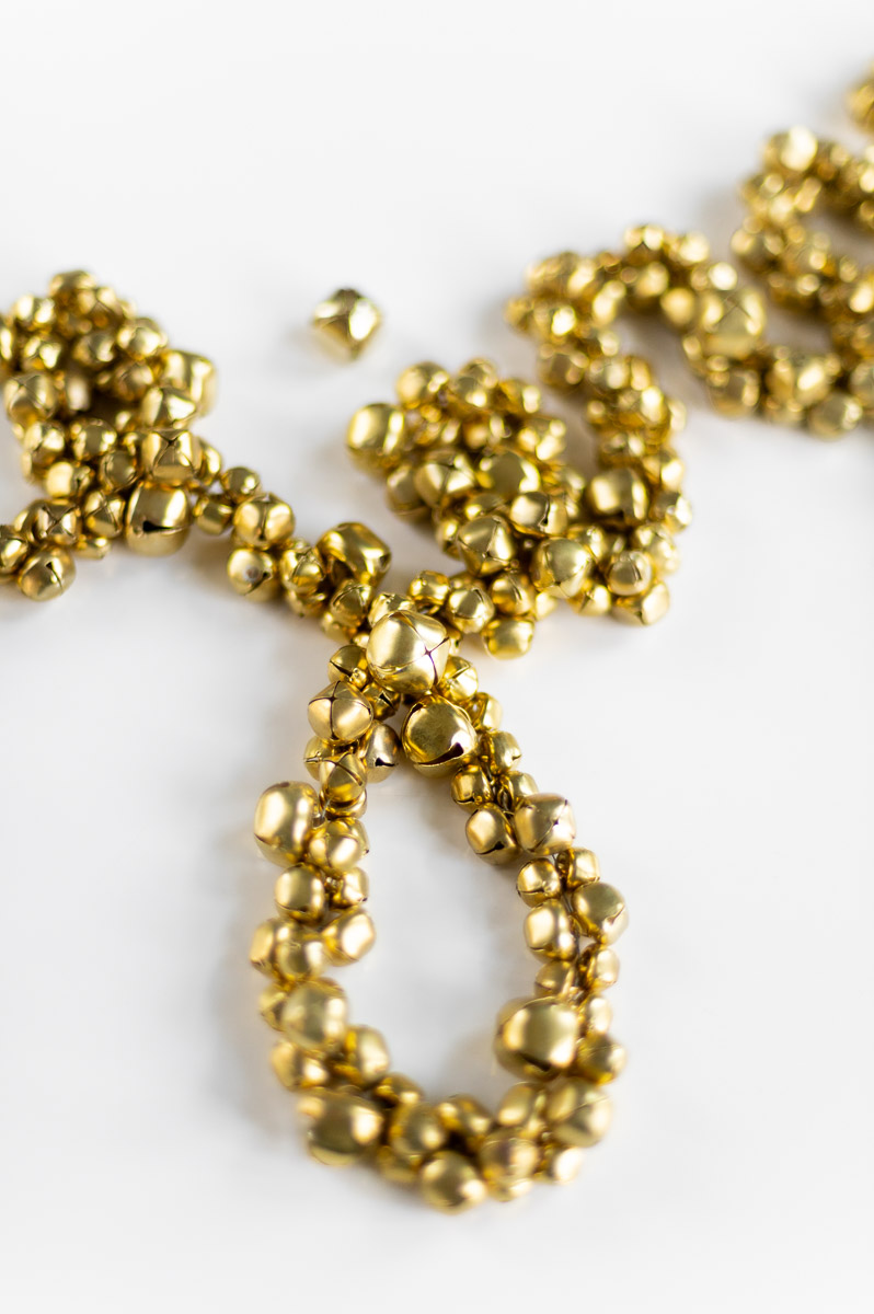 Affordable holiday decorations with handmade jingle bell garland DIY tutorial