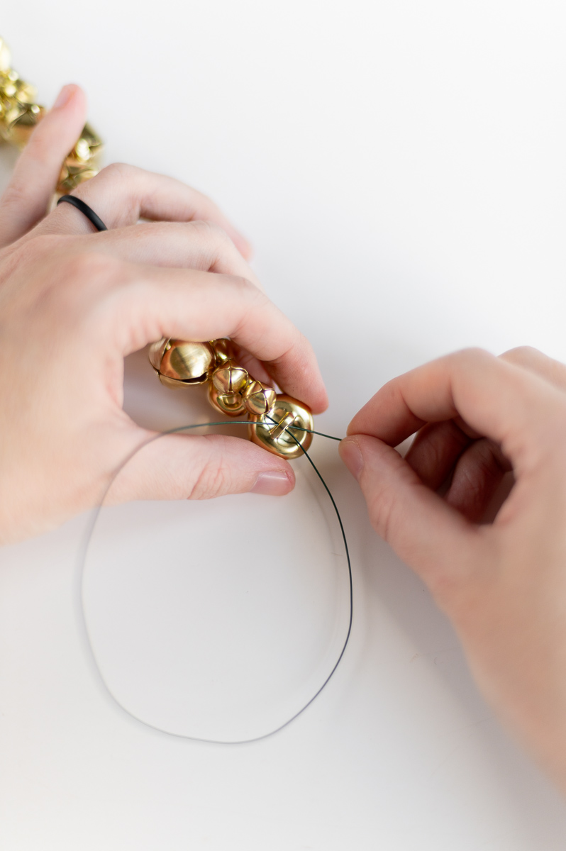 Budget-friendly DIY jingle bell Christmas garland made with Dollar Tree supplies