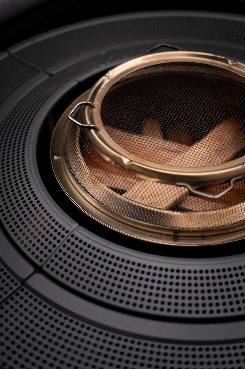 Solo Stove Bonfire with shield spark arrestor and surround on a wood deck