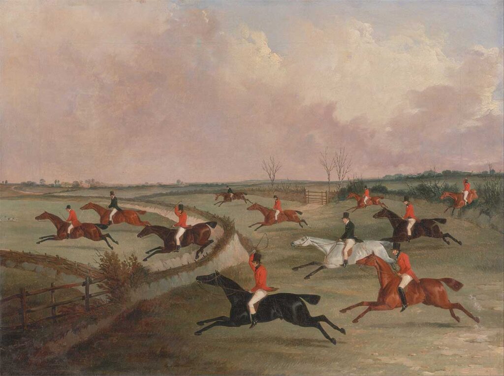free vintage fox hunt painting showing riders in red coats and top hats in full cry in an english countryside landscape