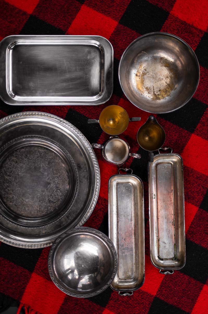 Overhead view of mismatched vintage silver platters – layering different shapes and sizes for s’mores grazing table styling.