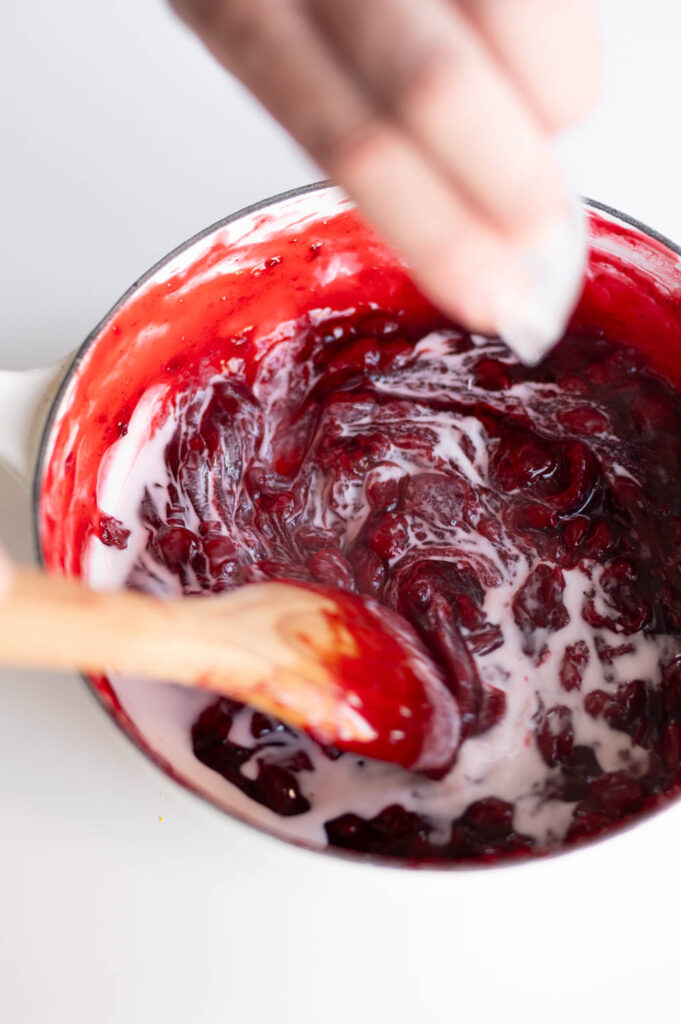 a slurry of water and cornstarch is added to upgrade canned cherry pie filling to help thicken the filling for use in easy cherry hand pies
