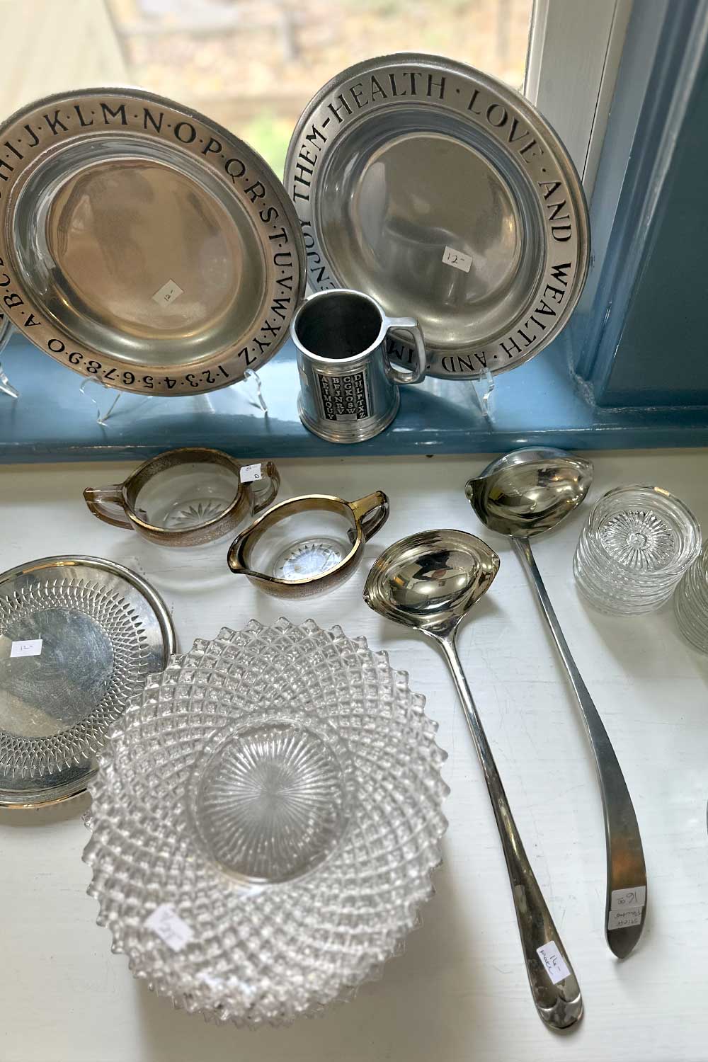 vintage silver and crystal serving ware seen while shopping for home decor at an estate sale