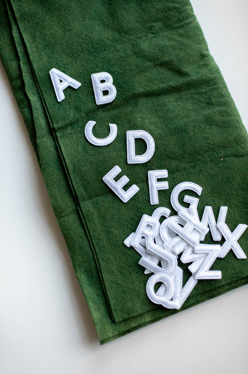 diy alphabet art nursery wall decor made using green felt and Iron-On Applique Letters