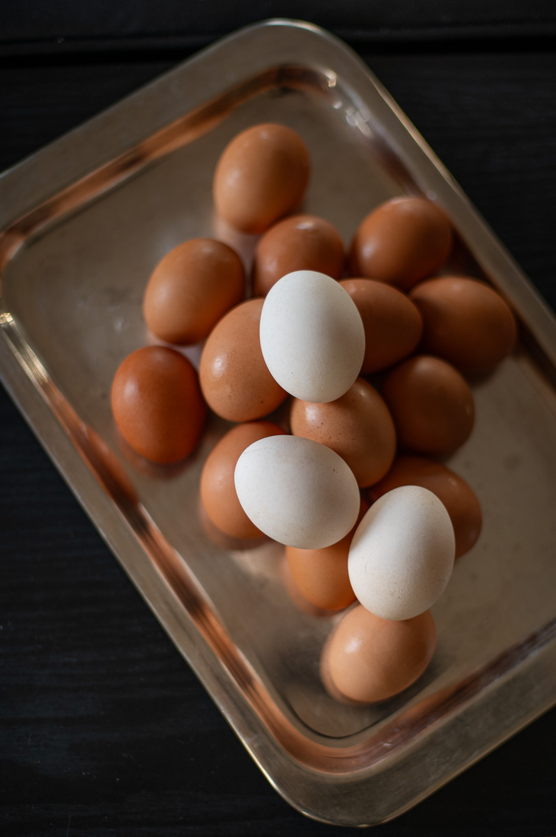 Before and after lightening brown eggs with vinegar for softer pastel Easter colors