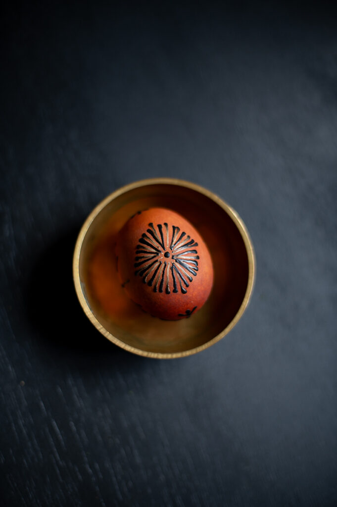 an example of how you can decorate brown eggs for easter using hot crayon wax and traditional drop-pull pin-drag wax application techniques.