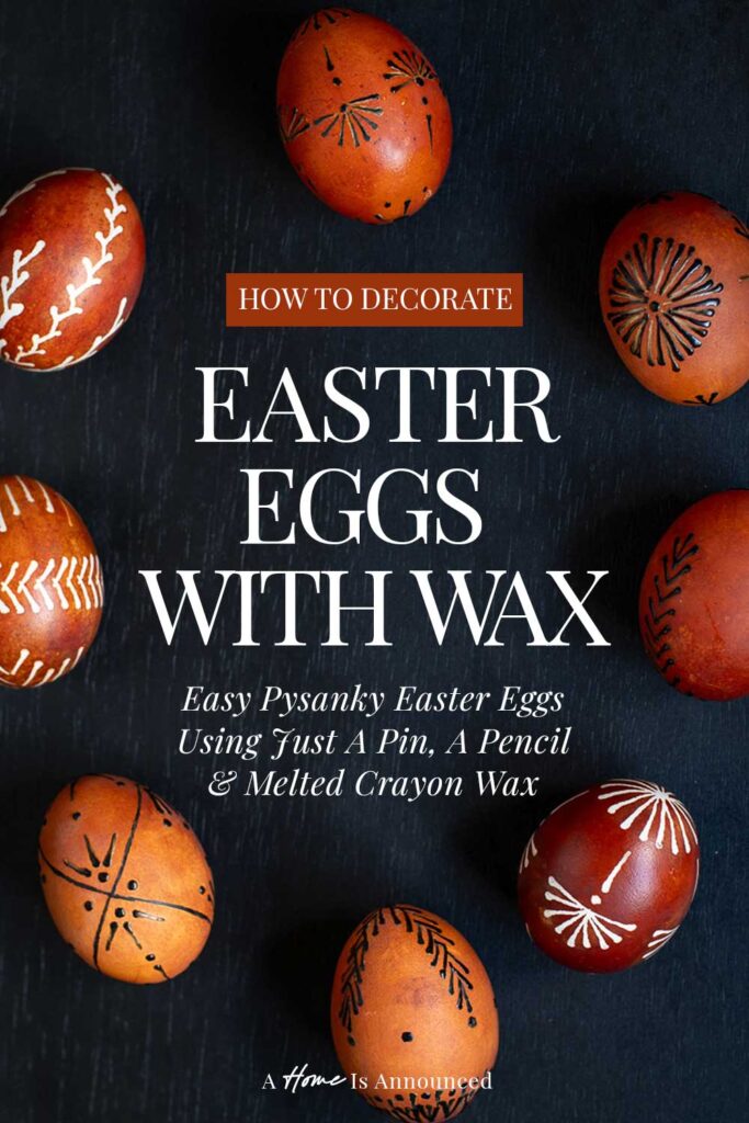 a group of easter eggs decorated with wax using traditional pin-drag drop-pull pysanky wax techniques sit on a table dyed with onion skins. A text overlay reads "how to decorate easter eggs with wax"
